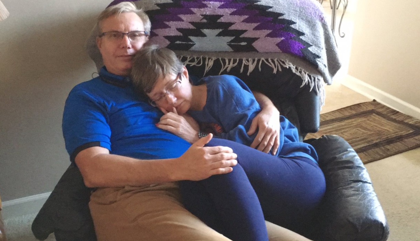 touching-photo-of-loving-husband-taking-care-of-wife-with-dementia